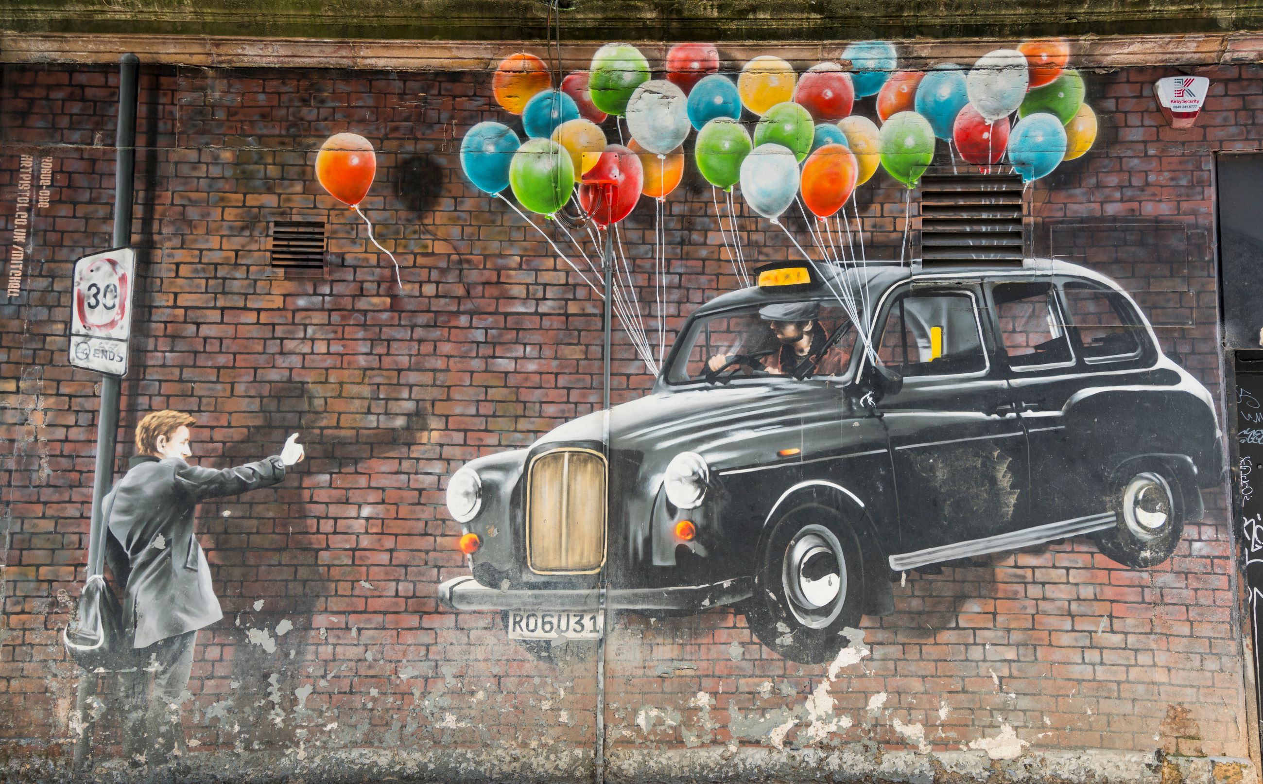Glasgow Taxi mural decorated in coloured balloons Glasgow Taxi mural decorated in coloured balloons